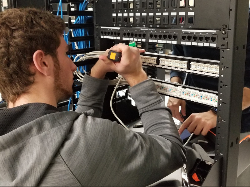 Student working on computer hardware